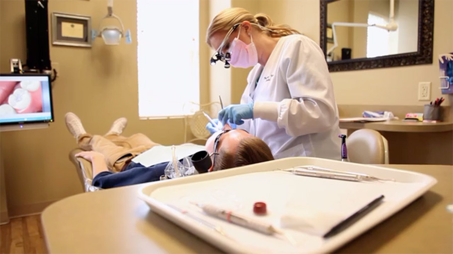Plano Texas dentist performing a dental exam on a patient