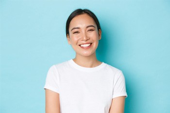 Someone smiling on a blue background