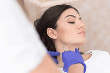 a woman in Plano experiencing TMJ disorder