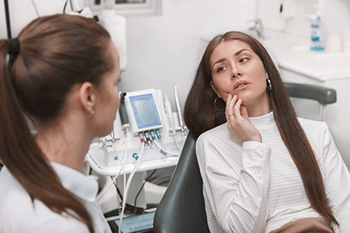 a patient asking her dentist about BOTOX for TMJ treatment