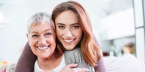 mother and daughter smiling with dental implants in Plano 