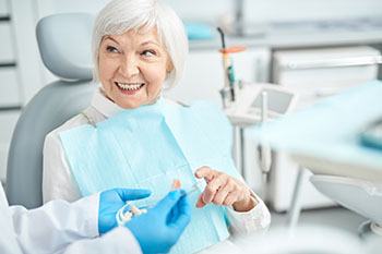 mature woman consultation with dentures in Plano 