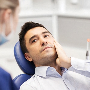 Man with toothache visiting emergency dentist in Plano