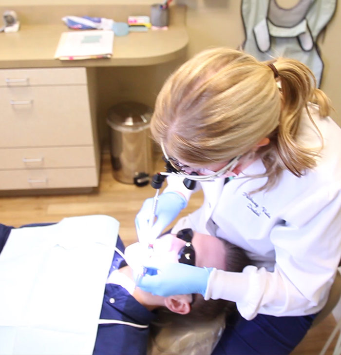 Plano dentist working on patient's smile