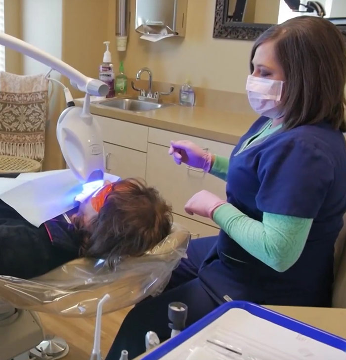 Plano dental assistant treating a patient