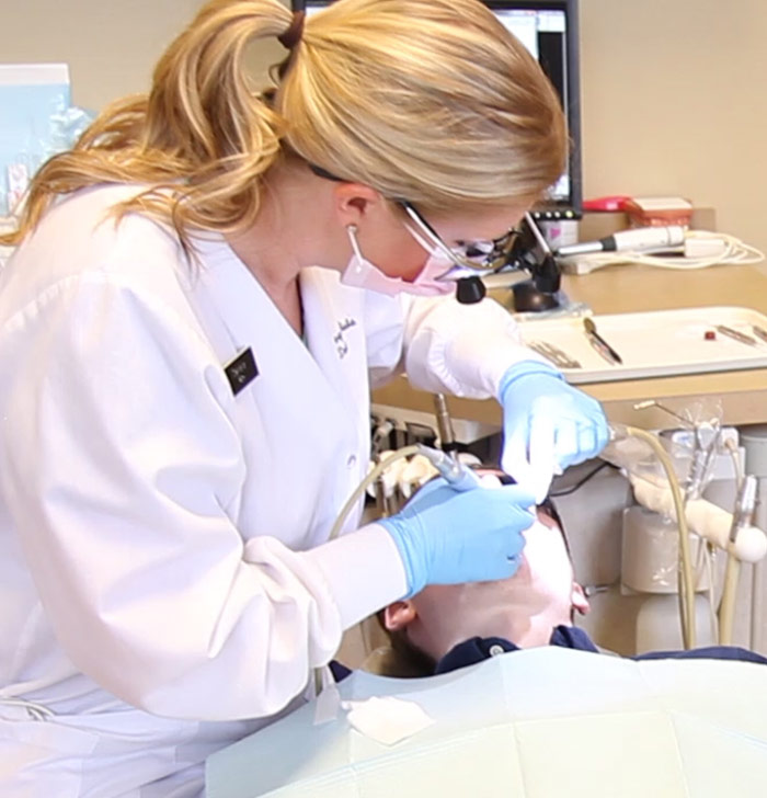 Plano dentist performing root canal