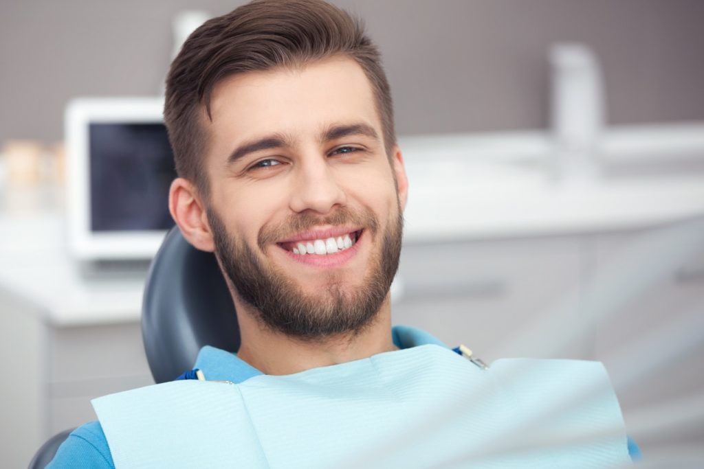 Smiling man at the dentist
