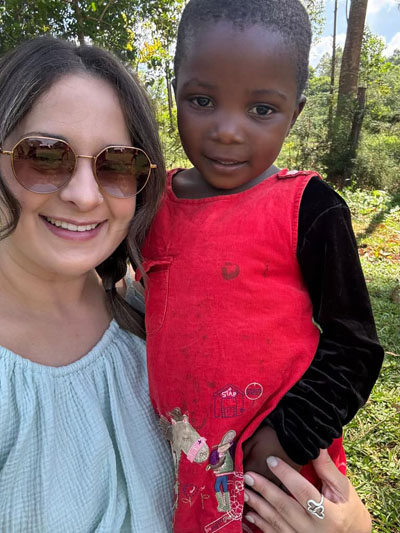 Cassidy from Parkway Vista Dental with her new friend on a mission trip in Kenya