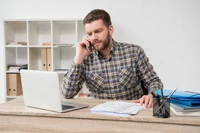 man scheduling a dental appointment at Parkway Vista Dental