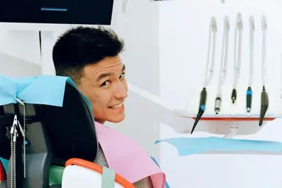 man smiling in the dental chair at Parkway Vista Dental