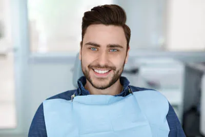 man smiling in the dental chair at Parkway Vista Dental